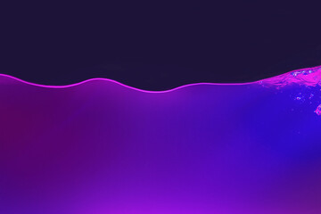 Waving water in aquarium in neon light against black background