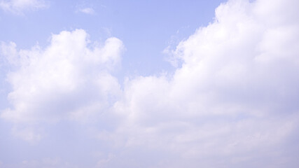 The clouds in the blue sky.