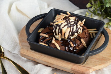 Fresh Baked Soft Chocolate Almond Cookie with Ice-Cream on Wooden Plate 
