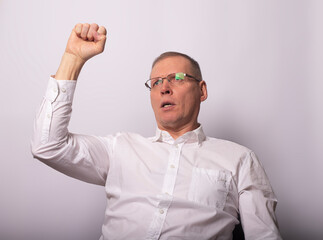 Adult man with fist up as gesture of support and solidarity