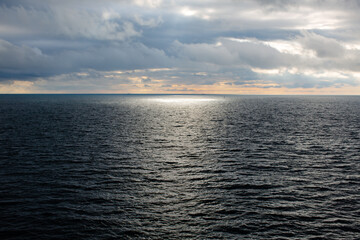 Fototapeta premium A ray of sunlight falls into the sea