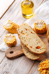 Sliced fresh baked corn and pumpkin bread on the decorated table