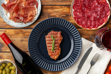 Grilled beef steak served on blue plate