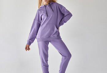 Young blonde woman posing in colorful hoodie without a print. Sweatshirt on girl isolated mock up