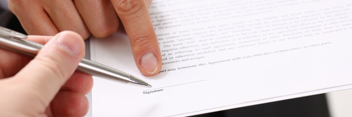 Male arm in suit offer contract form on clipboard pad and silver pen to sign closeup. Strike a bargain for profit, white collar motivation, union decision, corporate sale, insurance agent concept