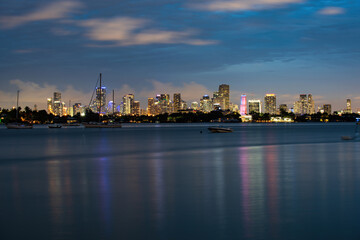 Naklejka na ściany i meble Miami city night. Panoramic view of Miami skyline and coastline.