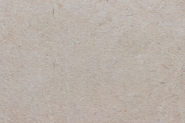 The texture of old worn faded cardboard.