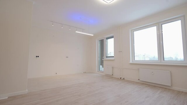 Moving in new apartment white flat interior, view of empty rooms new home construction.