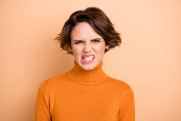 Portrait of young angry furious stressed unhappy annoyed girl stressed about problem isolated on beige color background