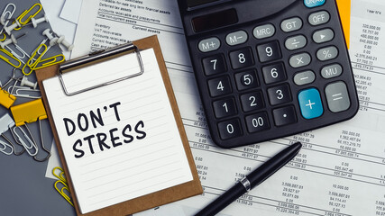 The words DonT Stress written on a white notebook