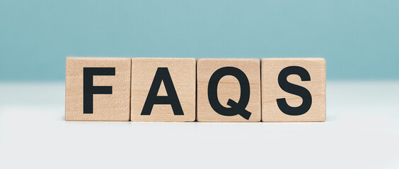FAQS - word concept from wooden blocks on blue background