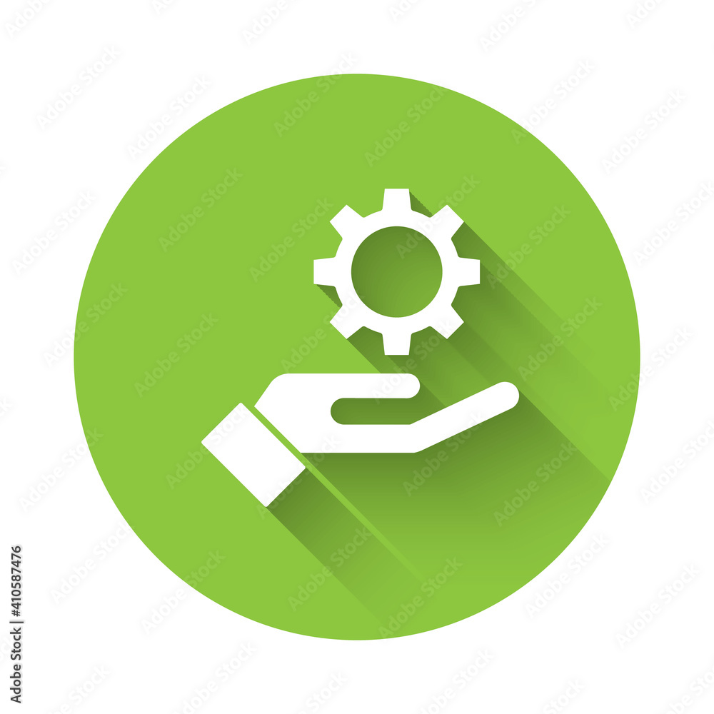 Poster white settings in the hand icon isolated with long shadow. green circle button. vector illustration.