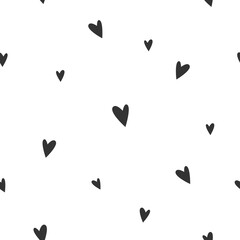 Seamless pattern with shabby black hearts on white background.