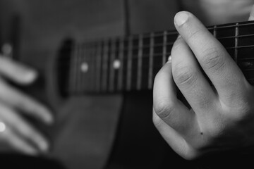 playing guitar with male hands close-up