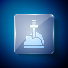 White Sword in the stone icon isolated on blue background. Excalibur the sword in the stone from the Arthurian legends. Square glass panels. Vector.