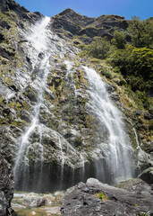 The Impressive 174m tall Earland Falls along the Routeburn Track, Fiordland, New Zealand. Vertical format.