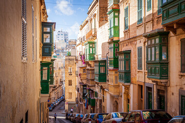 typical maltese street in valletta, malta, with balconies
