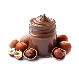 Chocolate cream on glass bottle with hazelnuts on white backgrounds.