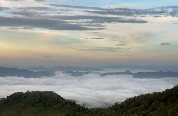 Over the view of fog on the mountain under beautiful sky.