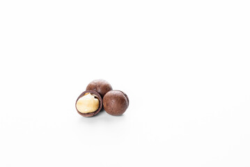 Macadamia nut on a white background. Macadamia nut oil. Peeled macadamia nut.