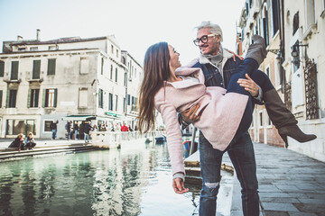 Naklejka na ściany i meble Happy young couple on vacation in Venice