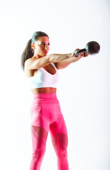 Woman training with dumbbells in the gym