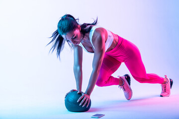 Woman training with the exercizes ball in the gym - obrazy, fototapety, plakaty