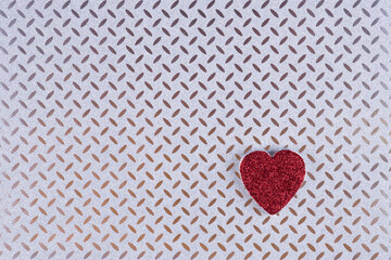 Red heart on metallic textured  background. Minimal Valentines day layout.