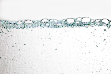 Closeup bubbles underwater on white background.