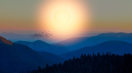 Beautiful landscape with blue misty silhouettes of mountains against super full moon rising "Elements of this image furnished by NASA" © muratart