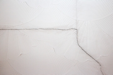 Artex ceiling cracking and breaking on the plaster board joins. Artex surface coating was a popular decorating choice during the 1970's and has since fallen out of favour in home renovations. 