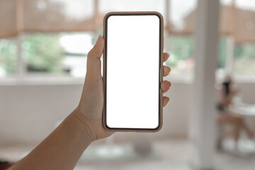 Women's hands holding cell telephone blank copy space screen. smart phone with technology concept