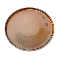 Empty earthenware plate on white background