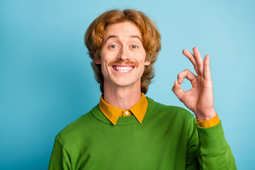 Portrait of young happy funky funny smiling cheerful good mood man showing okay sign isolated on...