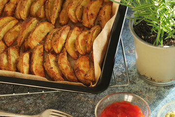 A tray with potatoes backed in oven	