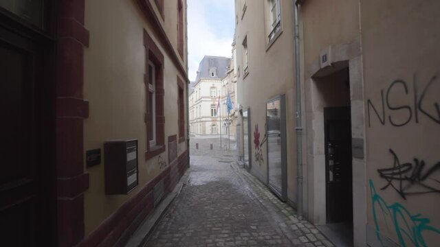 Walking At The Empty Alley With Graffiti On Walls During Pandemic In Luxembourg City. - POV