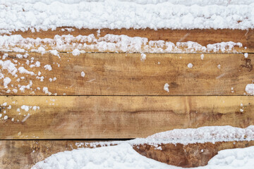 old rough wooden plank background, weathered and covered snow in winter, blizzard and snowfall