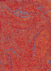 Abstract paper marbled painting, in red and orange with touch of turquoise, swirls and flows