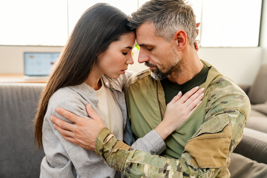 Sad Young Military Soldier Saying Goodbye To Sad Wife