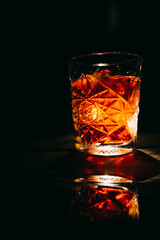 Red color male cocktail standing on wooden floor