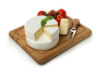 Board with camembert cheese, basil, fork and tomato isolated on white background