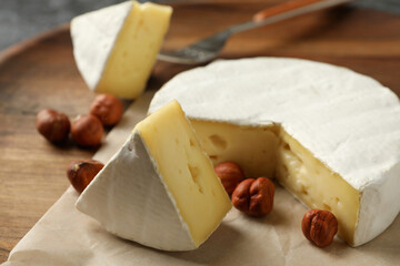 Board with camembert and hazelnut, close up