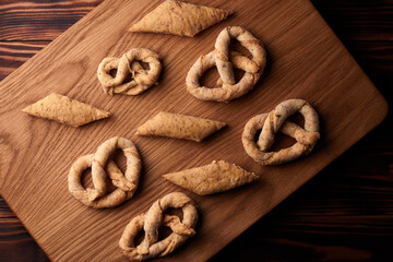 Top view of traditional italian homemade baked appetizer grissini on wooden board