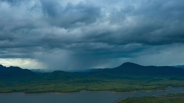 4K Hyper lapse, Rain storms and black clouds moving over the mountains In the north of Thailand, Mae Moh district, Lampang.