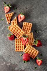Waffles with juicy strawberries.