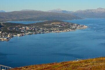 Fototapeta na wymiar overview photo of the arctic circle city of Tromsoe in northern Norway in summer., mountain view