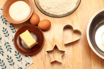 Baking Cooking Ingredients Flour Eggs Rolling Pin Butter And Kitchen Textiles On A Wooden Table. Top View of the Copy Space. Cookie Cake Or Cake Recipe Layout