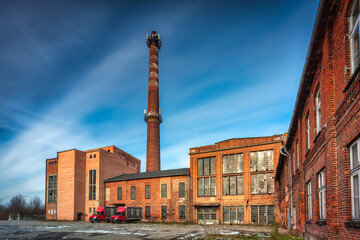 Fototapeta na wymiar Ruins of a brick sugar factory in Pruszcz Gdański in winter, Poland