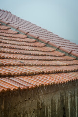 Rain dripping of the roof edge, Veli Iz, Island of Iz, Zadar archipelago, Dalmatia,, Croatia