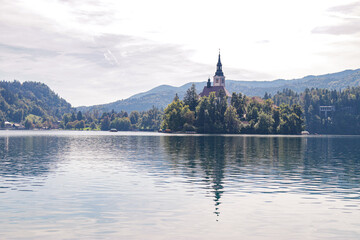Naklejka premium Panoramic view of Pilgrimage Church of the Assumption of Maria on Lake Bled, Slovenia